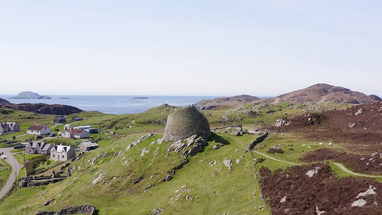 Advancing drone shot of the 'Dun Carloway Broch' on the west coast of the Isle of Lewis, part of the Outer Hebrides of Scotland