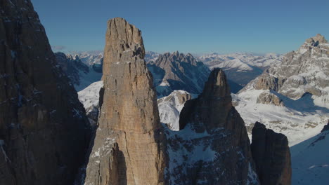 Slow-push-in-towards-Tre-Cime-South-Tyrol-extreme-sunlit-stone-peaks-mountain-rock-formation