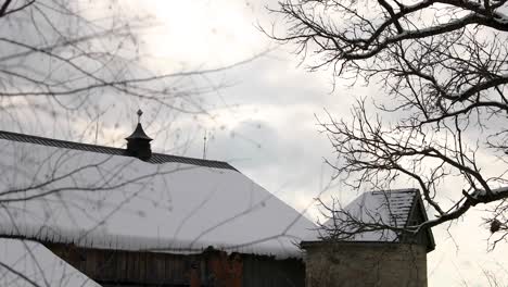 Sunset-Over-Snowy-Rural-Barn-In-4K