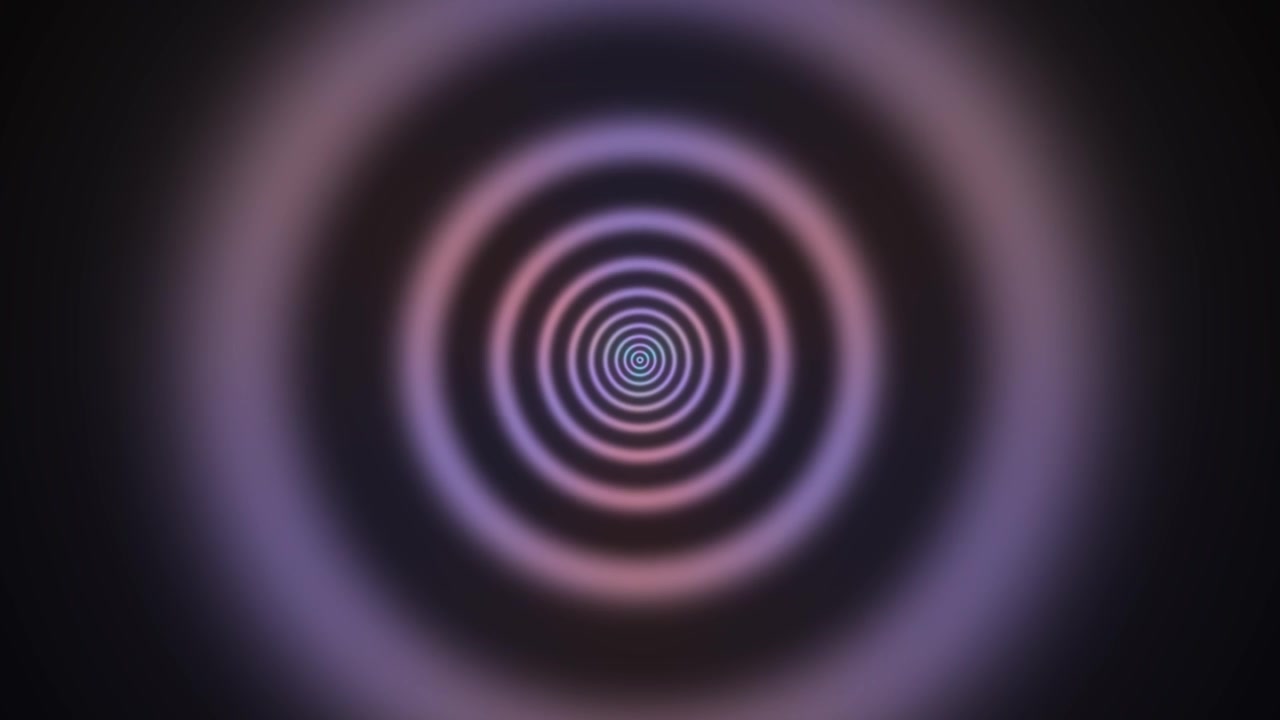 This visual features a spiral design with concentric circles filled with blue and purple hues. The pattern creates a sense of depth and movement in a dark background