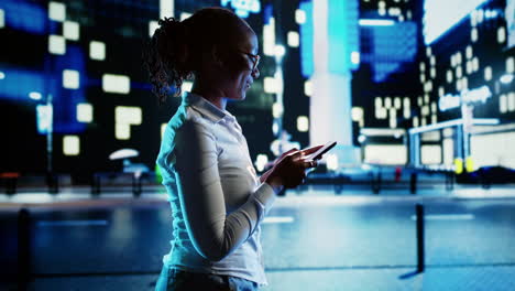 woman texting and walking on street