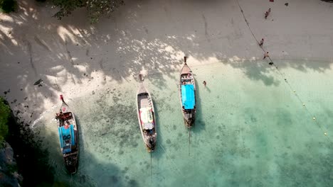 longtail boats on the shore of hong island