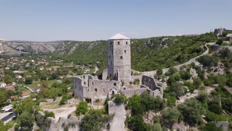 počitelj citadel in lush bosnian landscape. panoramic aerial