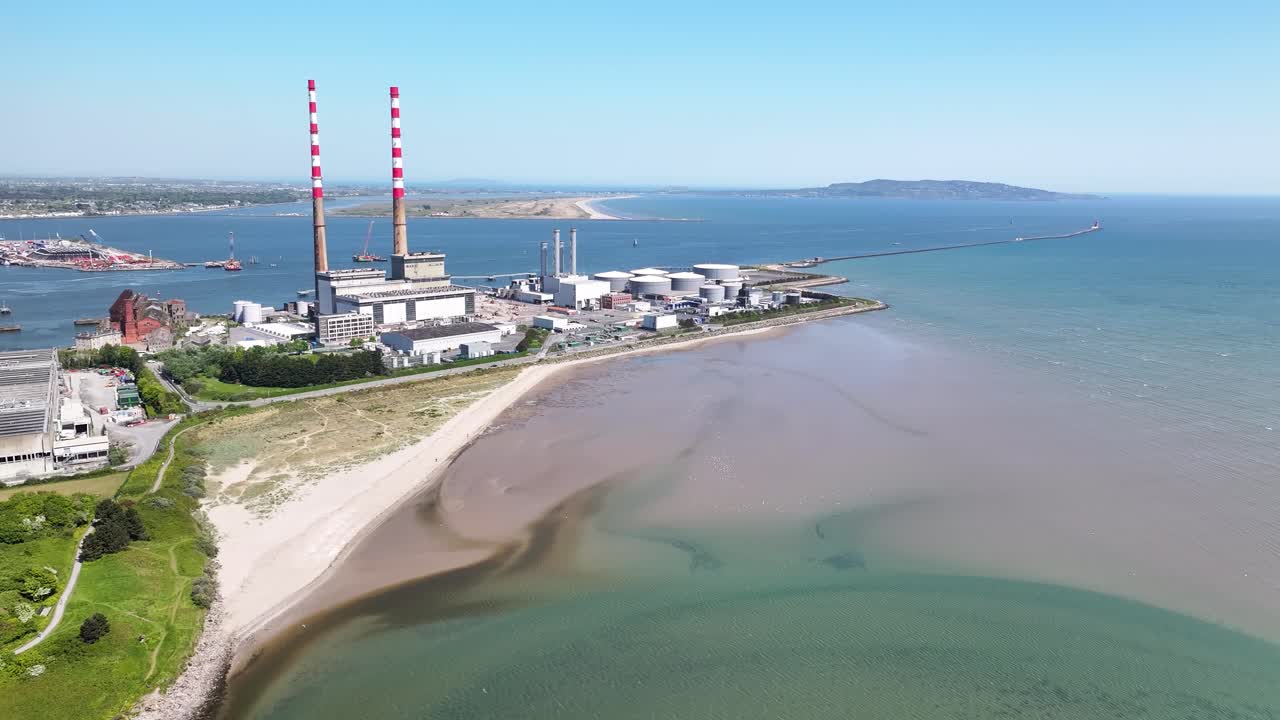 Poolbeg power station with chimneys in Dublin Docklands Industrial zone, aerial, sunny day