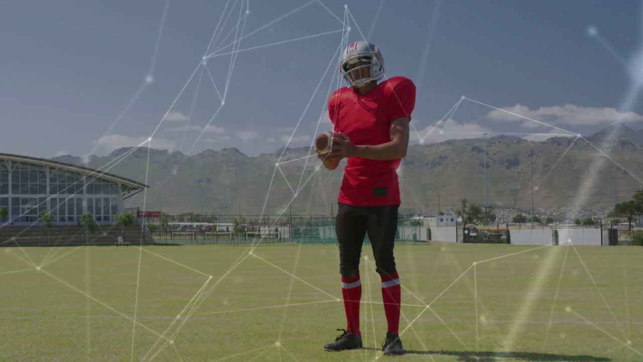 Holding football, player in red uniform with animation of network connections