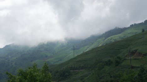 green mountains with low clouds in humid sapa, vietnam landscape