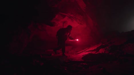 cave exploration in darkness with red light