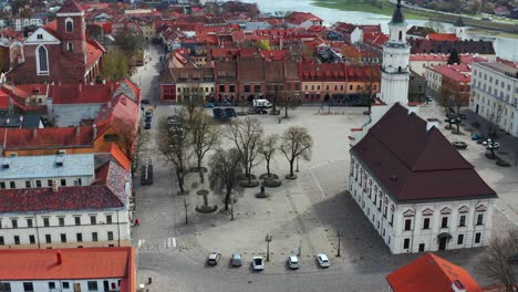 kaunas city hall with nemunas river, kaunas old town in lithuania - aerial drone shot