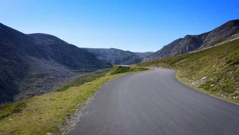 winding mountain road through a scenic valley