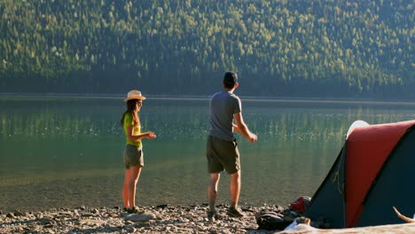 couple having fun near riverside 4k