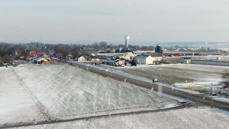 aerial over rural township in lancaster county during winter snowfall