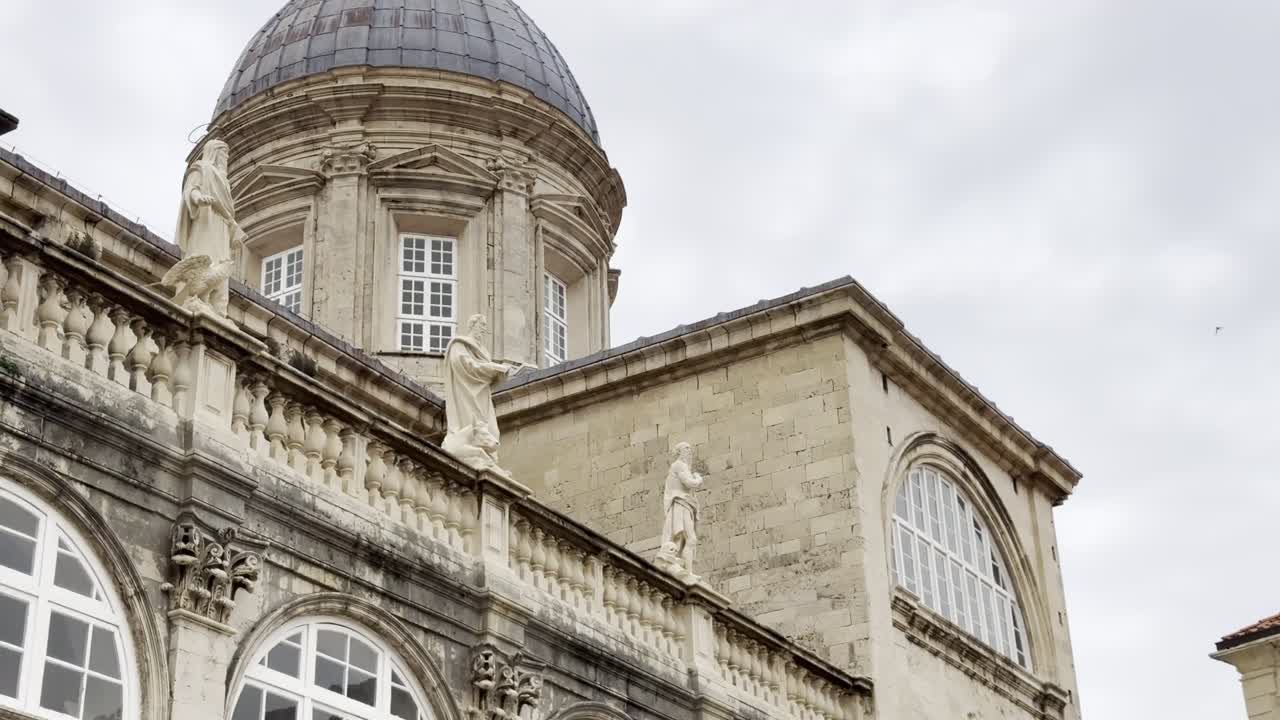 Cinematic view of Dubrovnik Cathedral of The Assumption of The Virgin Mary - with wonderful sandstone statues and a grand central nave in Dubrovnik's charming Old Town