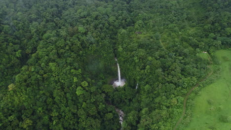 aerial orbiting cloudy la fortuna tropical waterfall costa rica jungle, 4k