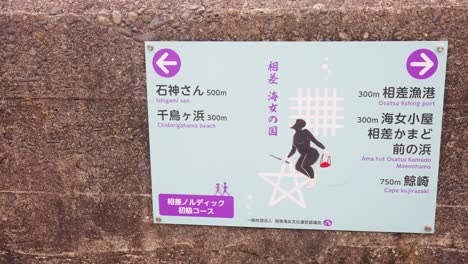 ama diver on sign in osatsu town, female diving traditional culture 4k