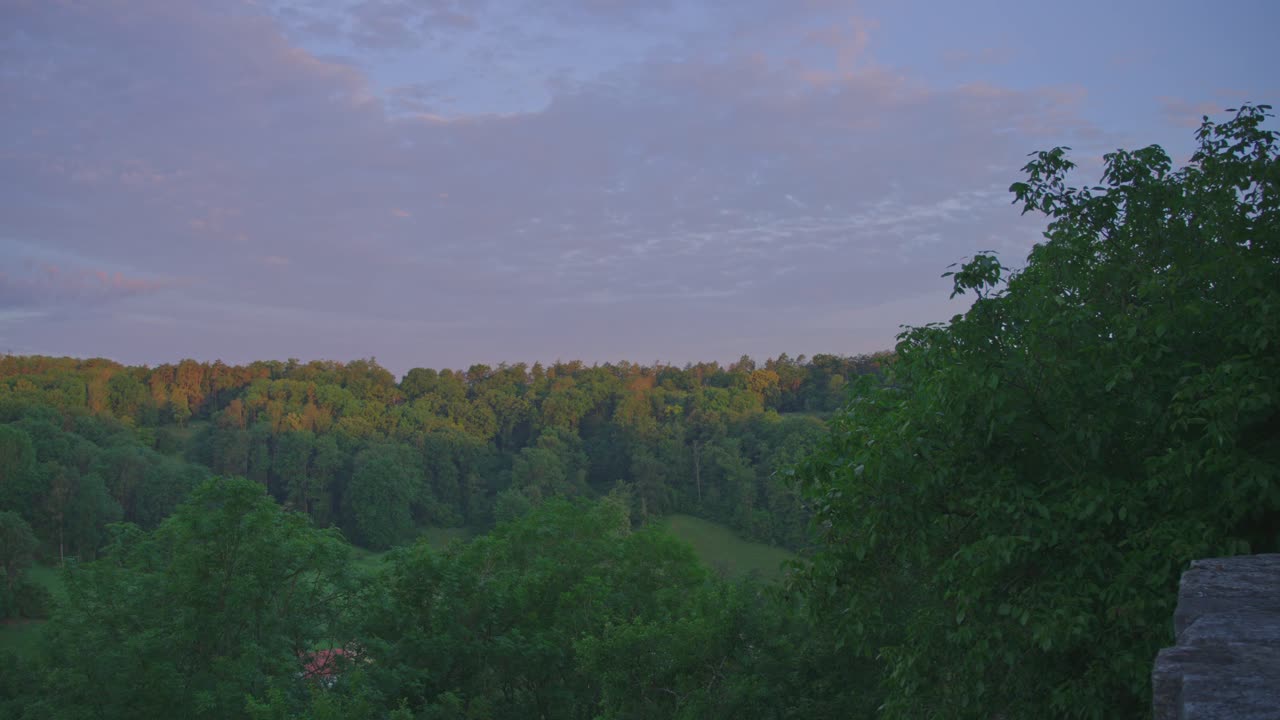 Scenic view of the forests around Rothenburg ob der Tauber, Germany, bathed in the warm light of the setting sun