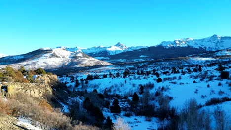 Flight-over-a-wooden-fence-towards-the-Sawatch-Range-in-Colorado