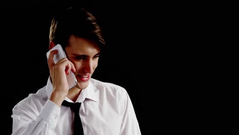 Androgynous-man-talking-on-mobile-phone