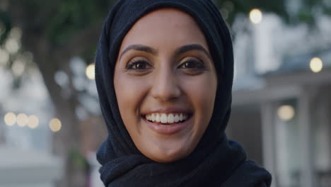 portrait beautiful indian woman smiling in urban night time scene
