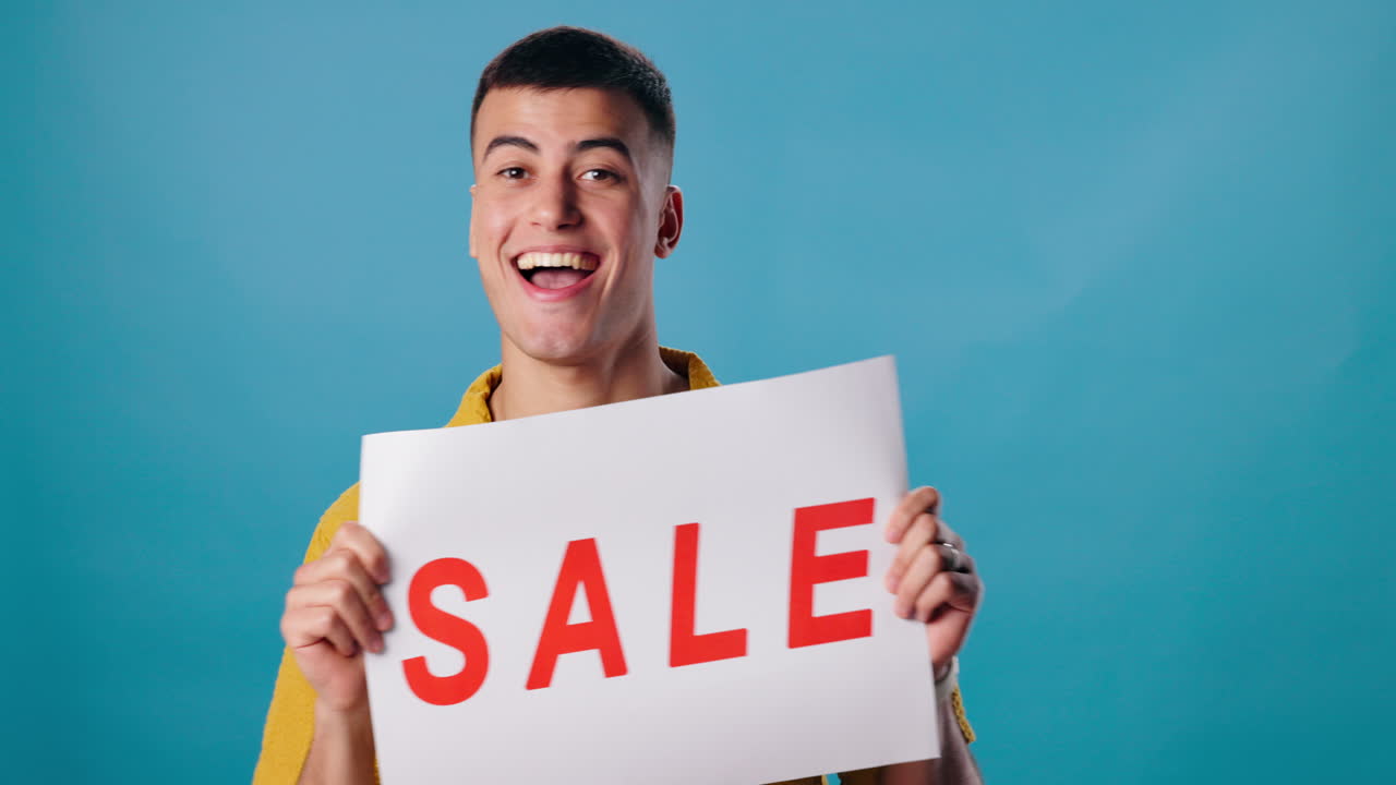 Man Holding Sale Sign