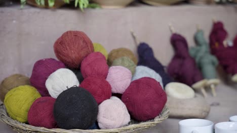 Natural-Hand-Dyed-Wool-Balls-By-Artisans-In-Chinchero,-Cusco,-Peru