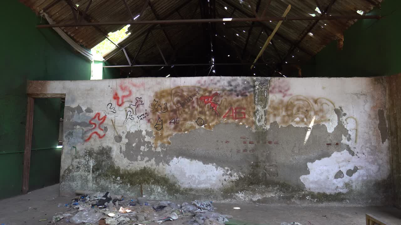 Abandoned building with trash on floor