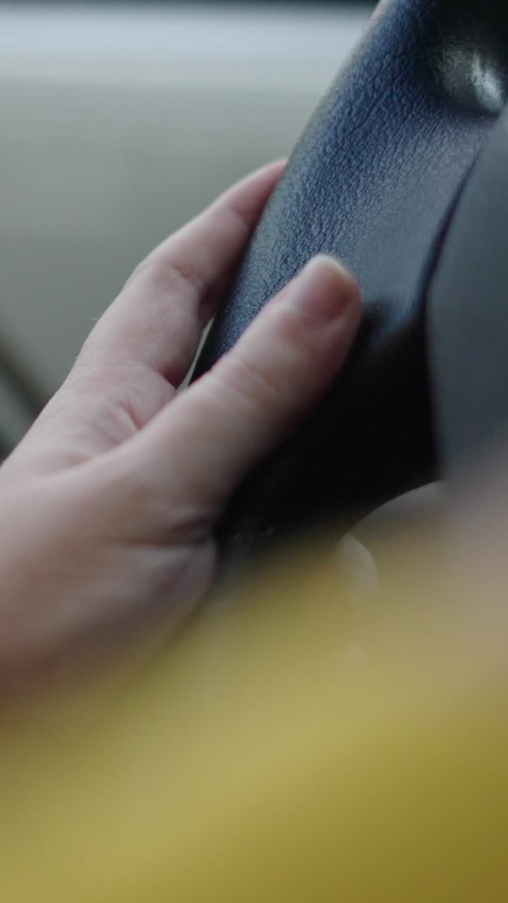 Hand on a Steering Wheel