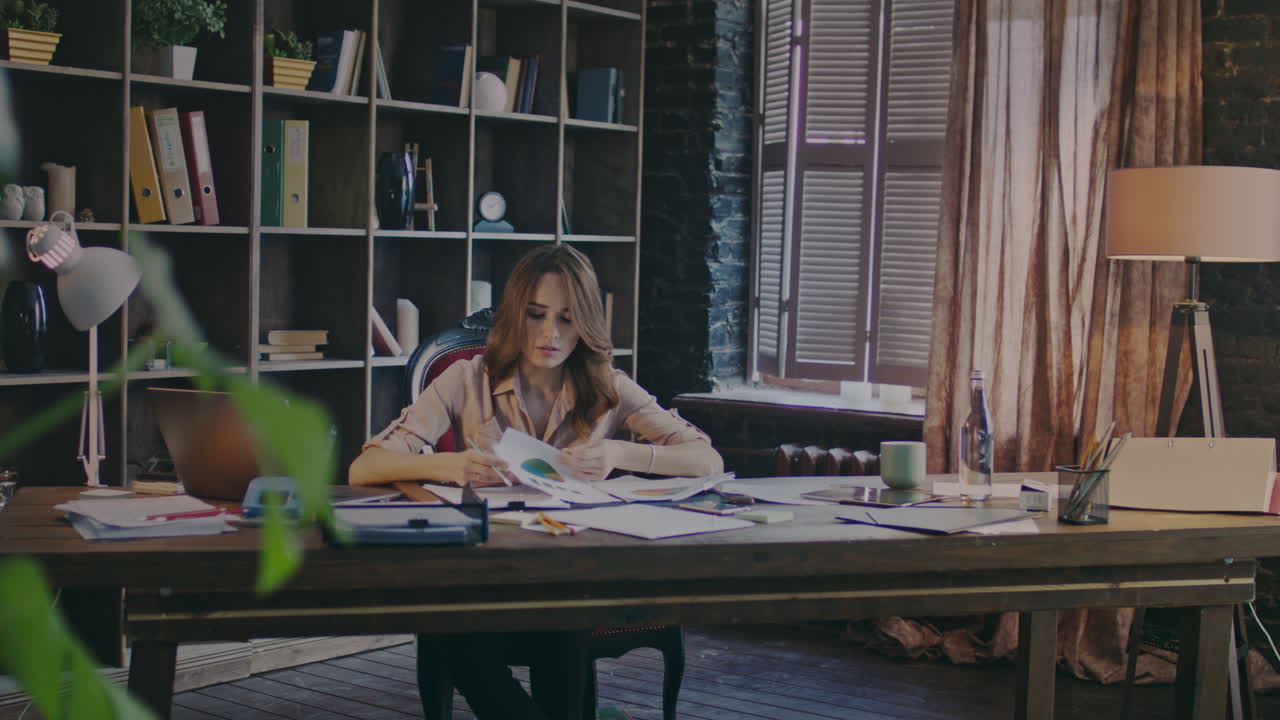 Attractive businesswoman analyzing data. Data management. Woman analysis report