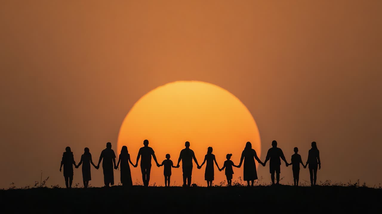 A Silhouette of Unity: A Group of People Holding Hands Against the Backdrop of a Stunning Sunset, Symbolizing Togetherness and Connection