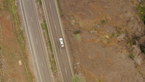 top down aerial of butte creek lookout, flying over road, rocky mountain range