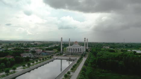 landscape drone camera sunset at mosque of songkhla province,thailand. beautiful grand mosque in ramadan day evening sunset. video nature color 4k resolution.