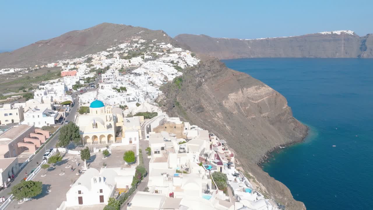 Discover the breathtaking beauty of Santorini's dramatic cliffs and caldera, unfolding beneath your drone's lens