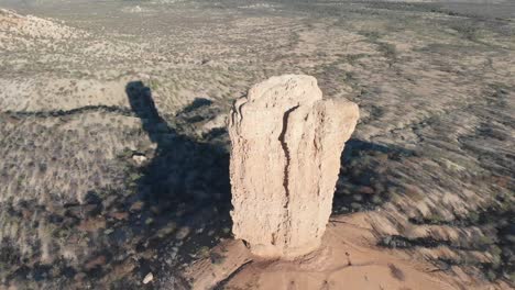 high altitude drone aerial video footage of impressive rock formation vingerklip, namibia, africa. tall stone monument in african desert. monument valley look alike. vast namibian outback. drone flying over top of the rock.