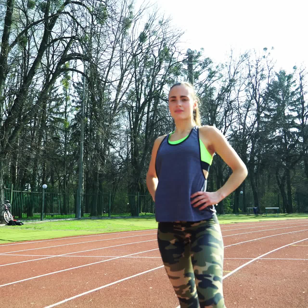 Runner athlete doing exercises at the stadium. Sports shoes. Healthy Lifestyle