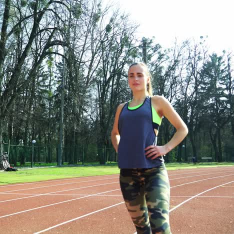 runner athlete doing exercises at the stadium. sports shoes. healthy lifestyle