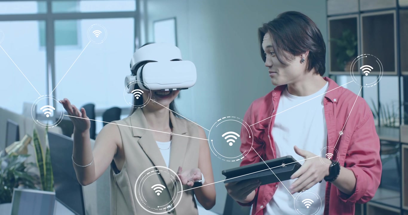 Female developer donning VR headset pulling Wi-Fi icons, engineer swiping tablet activating net map