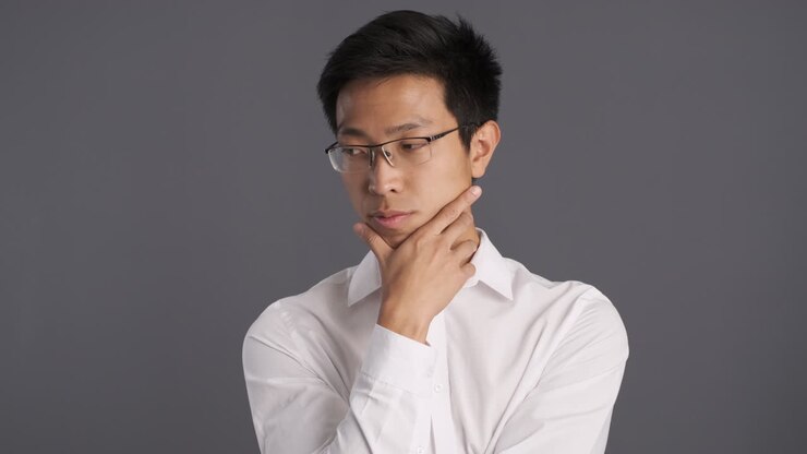 Reflexive Asian man agreeing in front of the camera.