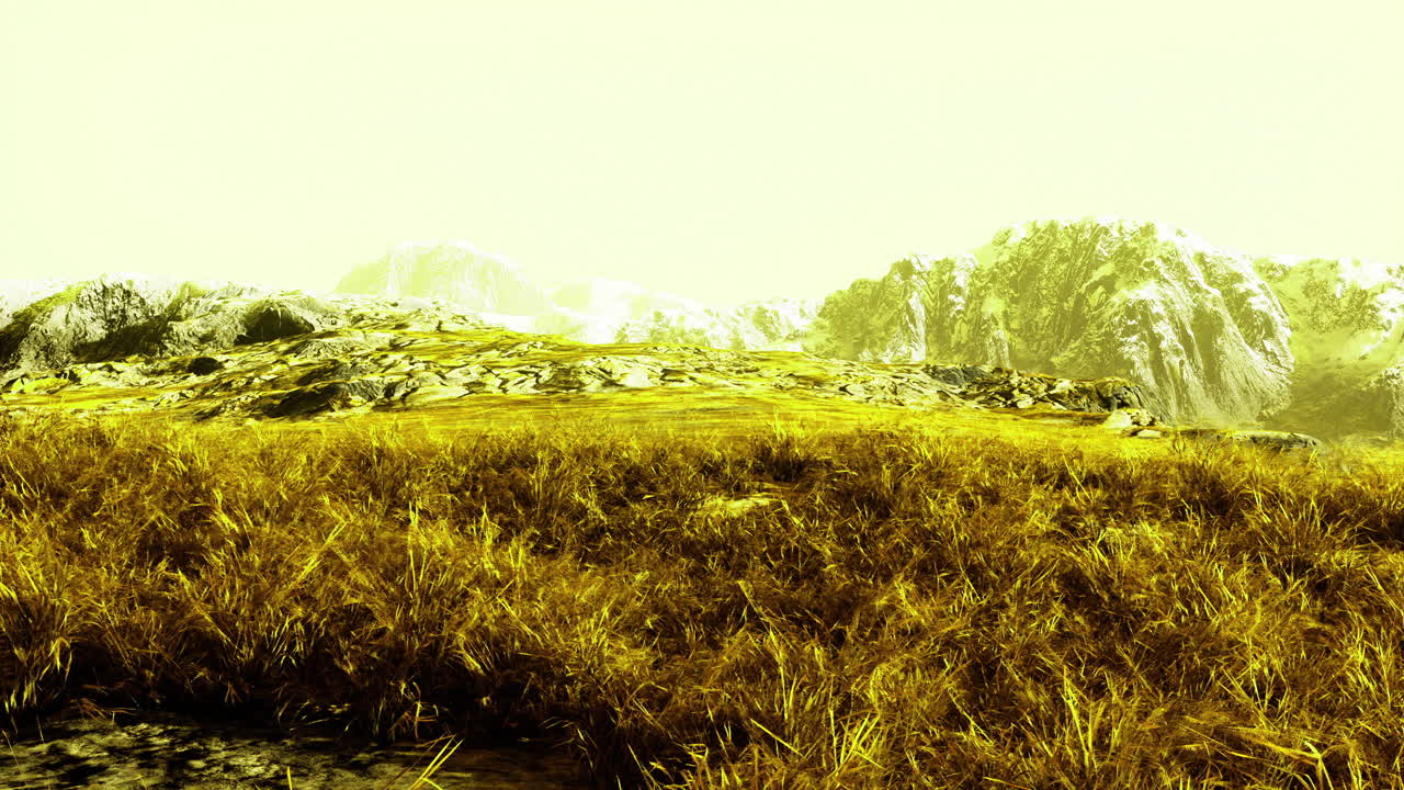 Vibrant landscape featuring glowing grass and distant snow capped mountains