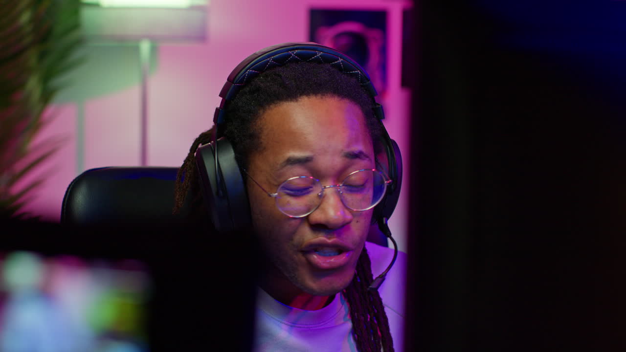 Man Playing Video Games With Headphones