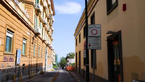 street signs and narrow alley in naples