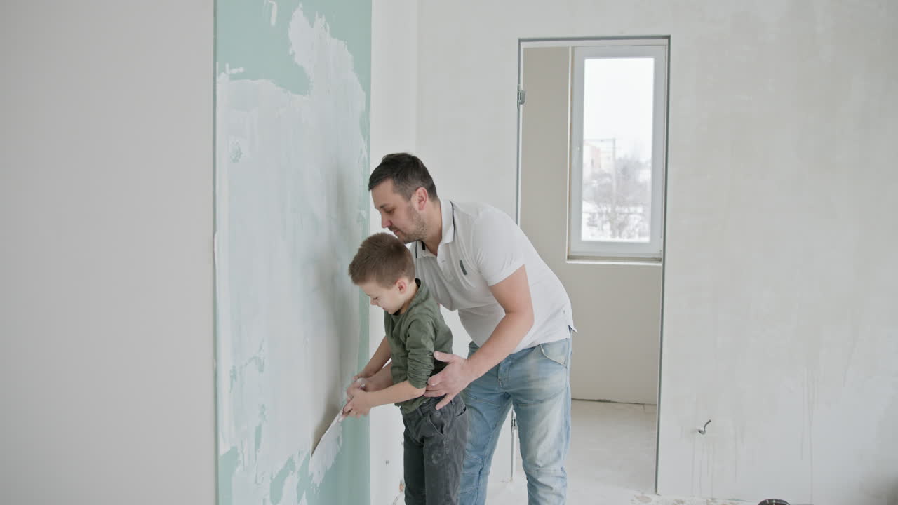 Father and Son Repairing Wall Together