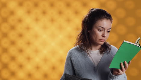 Sleepy-woman-struggling-to-keep-eyes-open-while-reading-book,-studio-background