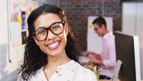 Business-executive-smiling-in-office