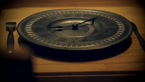 clock hands spin rapidly on empty plate expressing concept of fasting from food