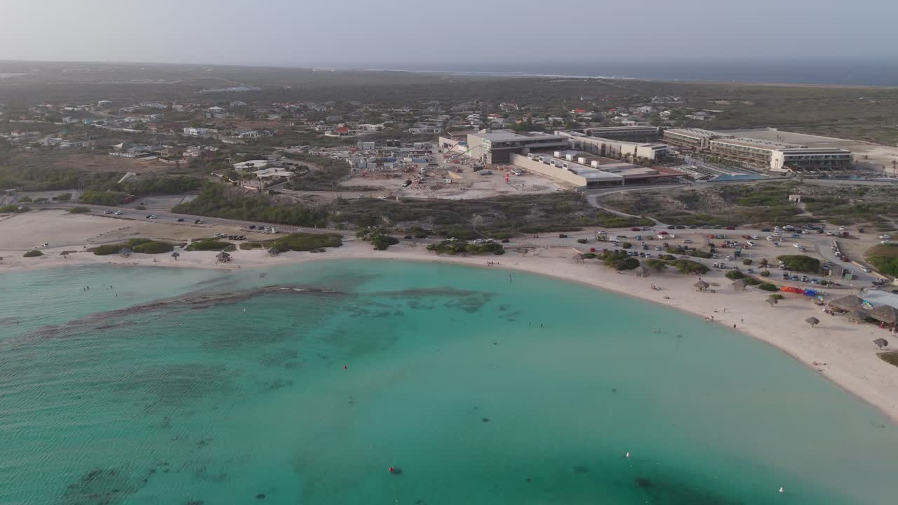 Surroundings of Baby Beach, with hotels and houses surrounding it, Aruba