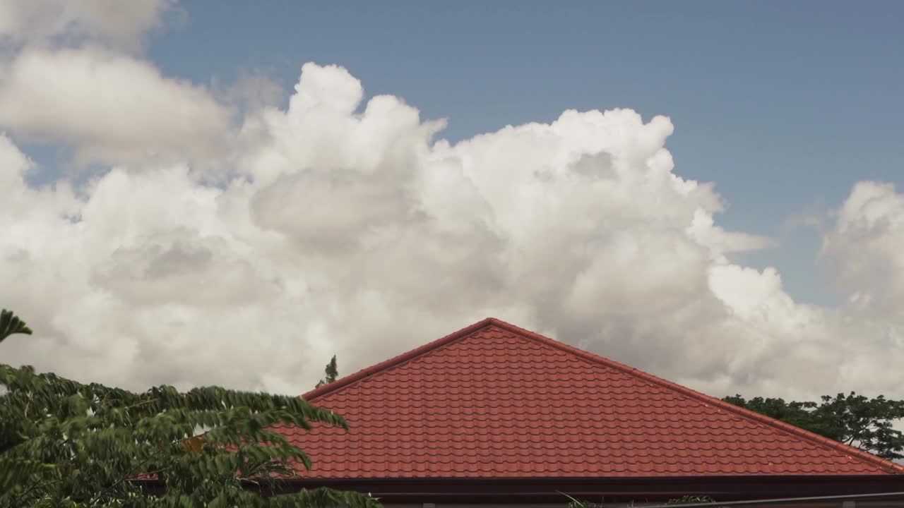 Cloud Timelapse by the roof moving fast on a hot afternoon.
