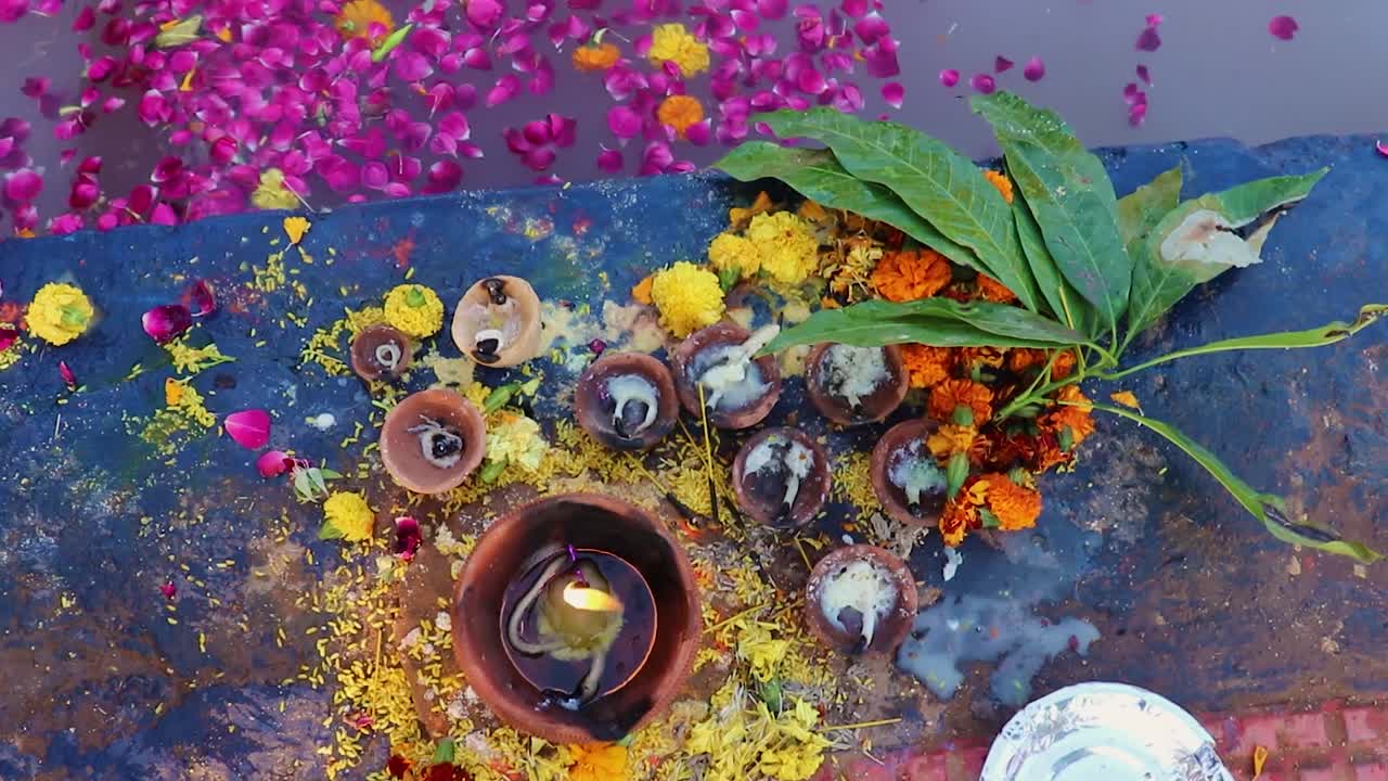 burning oil lamp at river shore during holy rituals at festival from different angle video is taken on the occasions of chhath festival which is used to celebrate in north india on Oct 28 2022