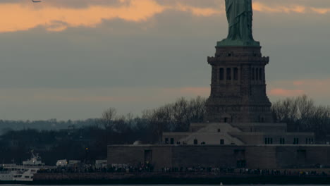 tilt up to statue of liberty at sunset