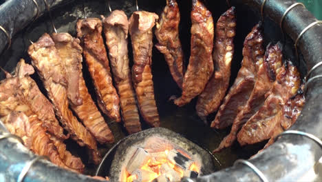 grilling barbecue pork ribs in jar - street food style