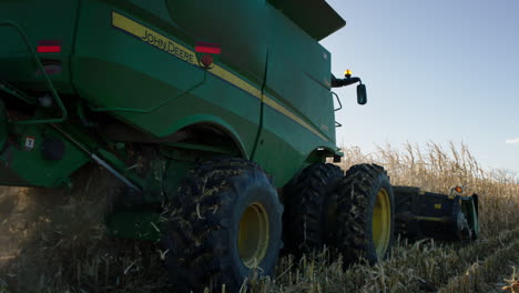 combine harvester, sunny day, slow motion