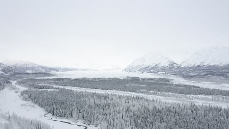 Drone-pulls-away-from-snowy-glacier-in-Alaska